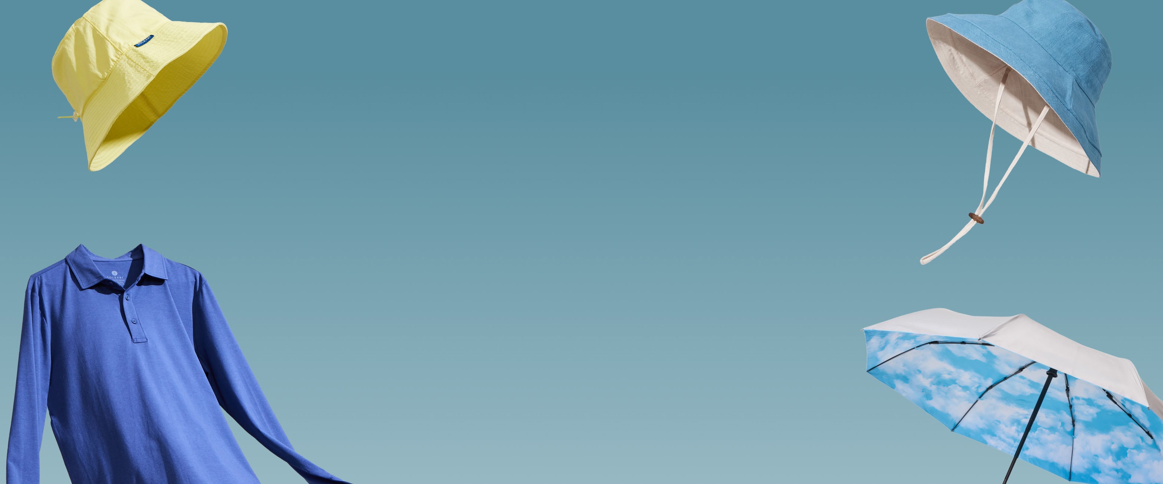 Hats, a top and an umbrella floating on a light blue background.