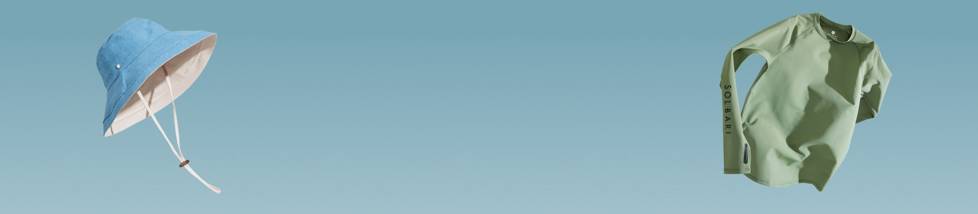 A blue sun hat and a green top floating on a light blue background.