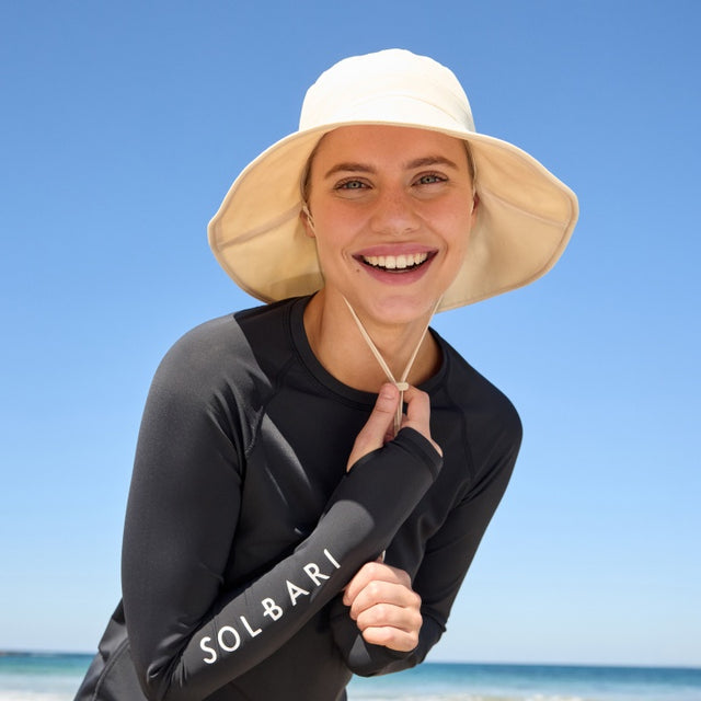 Lady wearing Solbari hat and rash top