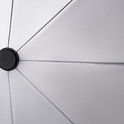 Close-up of a silver umbrella with a black handle