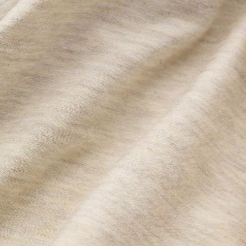 Close-up of beige fabric with a subtle pattern
