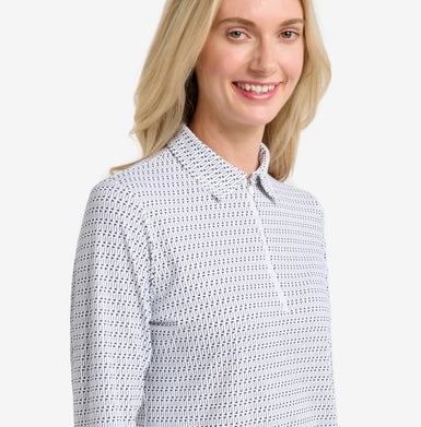 Woman wearing a patterned shirt on a white background