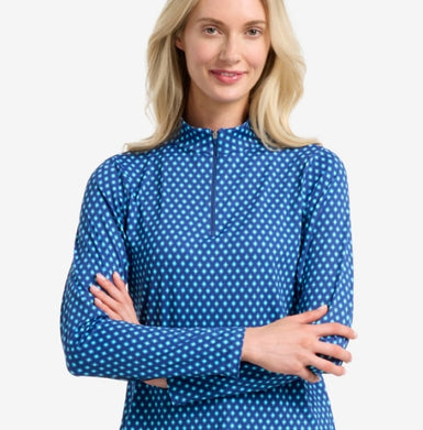 Woman wearing a blue diamond print long-sleeve shirt on a white background