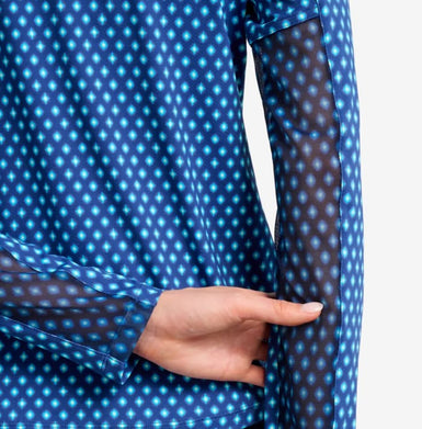 Blue diamond print shirt with sheer long sleeves, hand pointing at the sheer fabric.