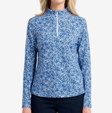 Woman wearing a blue and white patterned long-sleeve shirt on a white background