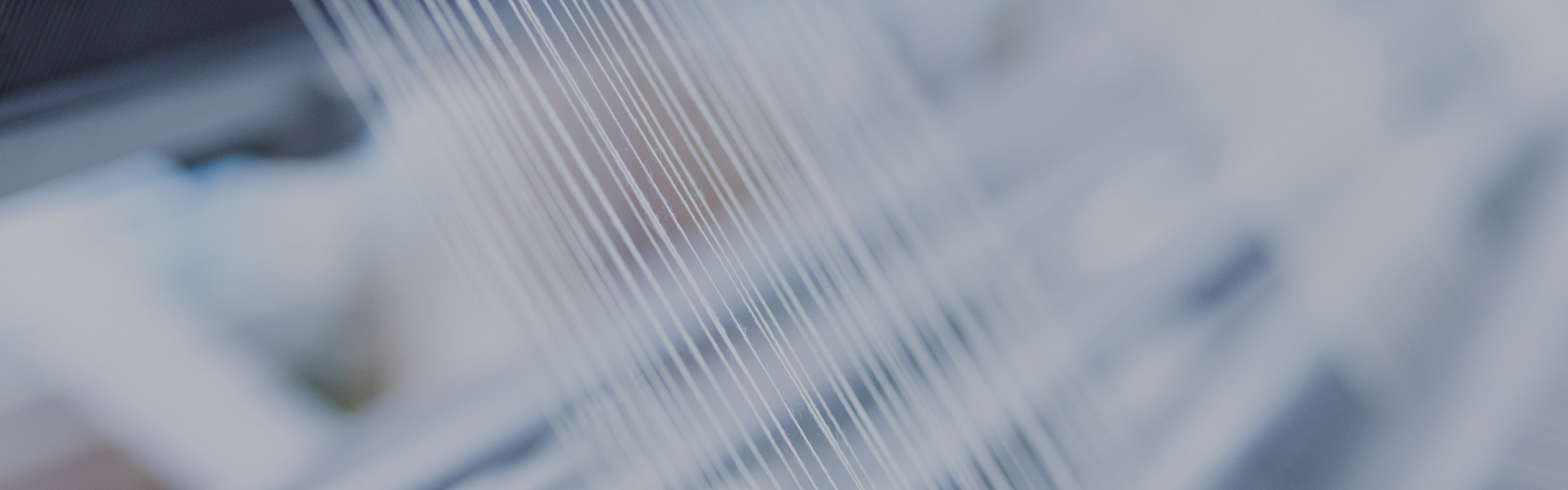 Close-up of a woven fabric texture with a blurred background
